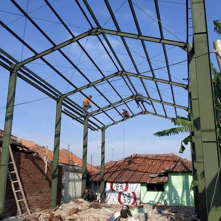 Construction worker welding metal