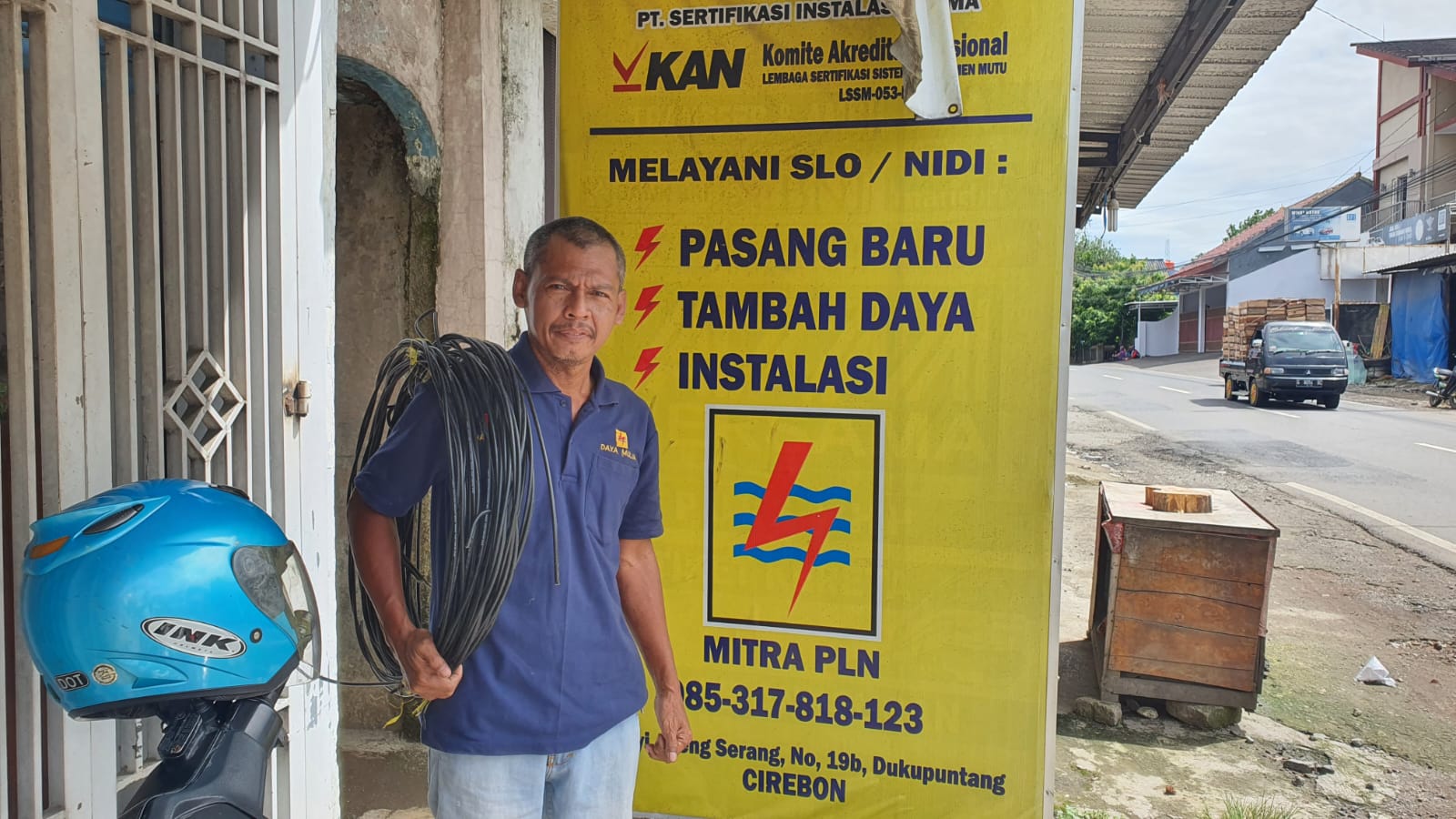 Electrician working on electrical panel